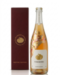 Tomadoro Festive Edition 75 cl, a non-alcoholic tomato-based drink in a bottle hand-painted with gold leaf and Swarovski crystals by artist Mart Krijger, next to its burgundy gift box with gold logo